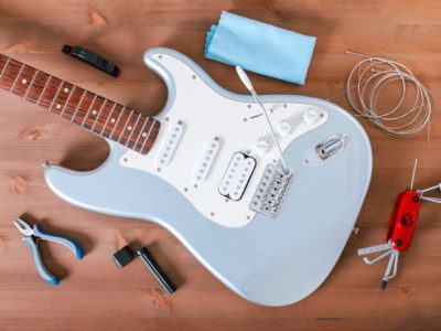 electric-guitar-body-new-strings-and-guitar-tool-kit-for-guitar-care-800x533